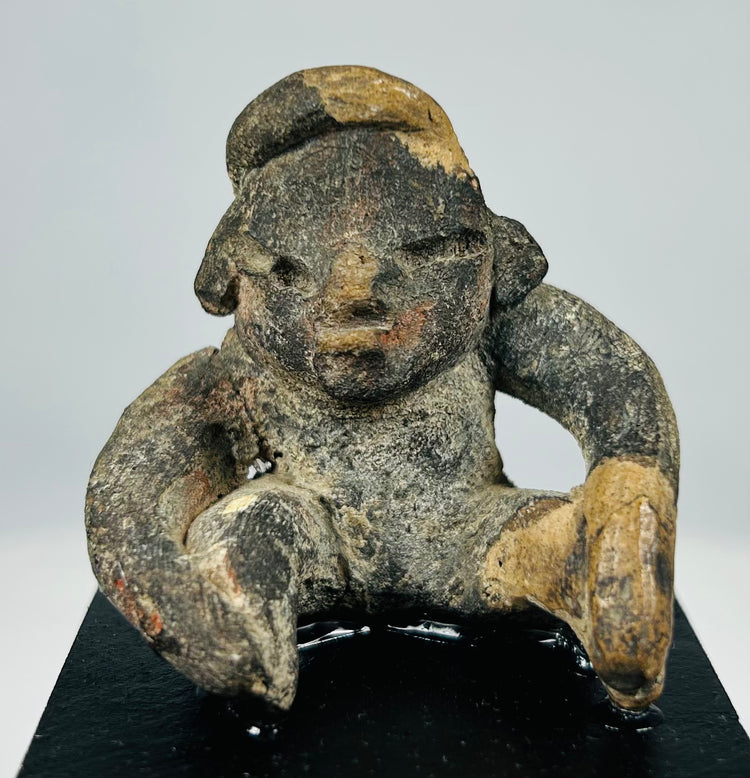 Pre-Columbian shaft tomb terracotta figure from West Mexico with compact seated posture and ritual presence