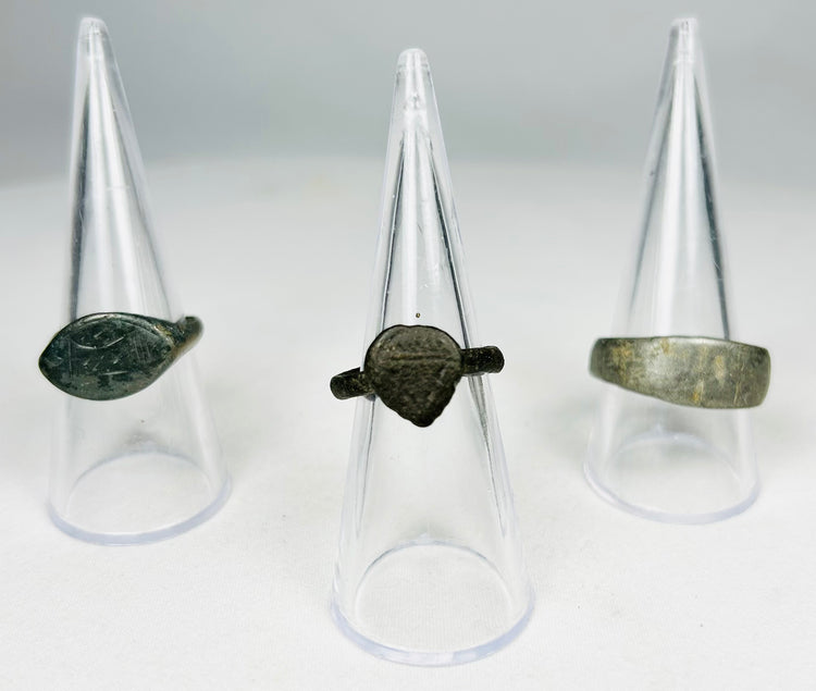 Collection of ancient bronze rings showing patina and excavation aging