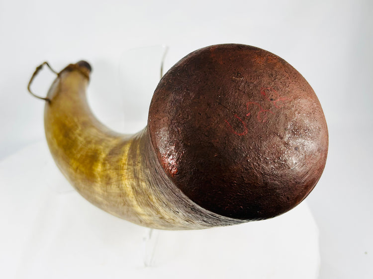 Historic black powder horn with wooden base plug and leather suspension