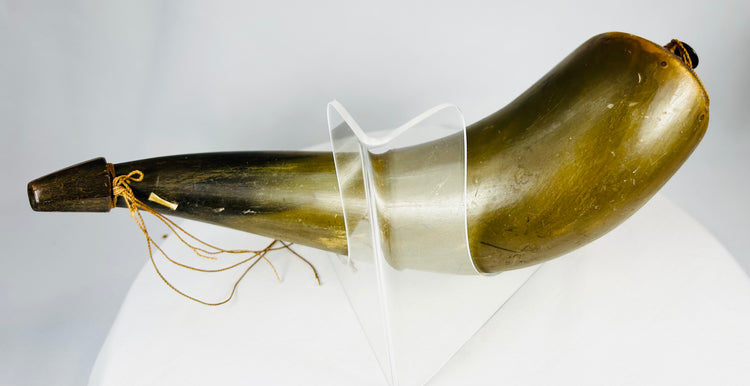 Rear view of antique horn flask showing fitted wooden base and label