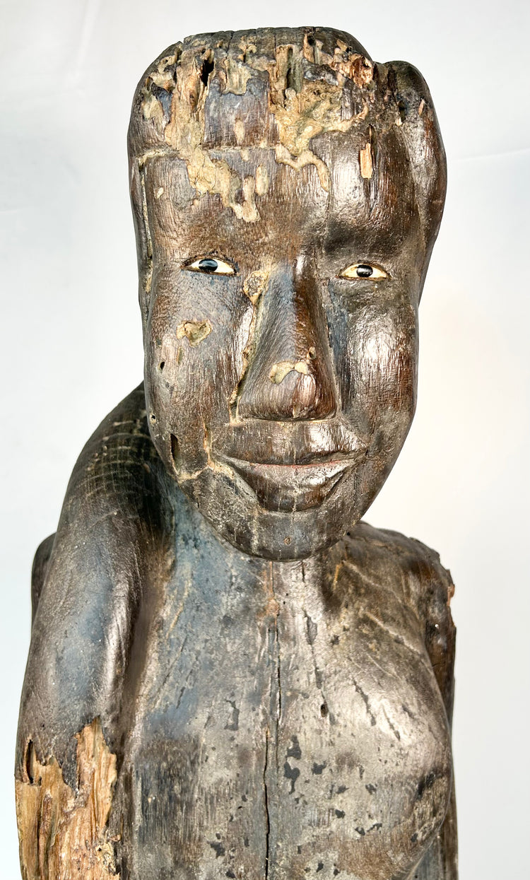 Late 19th century Dayak ritual guardian sculpture mounted on wood base