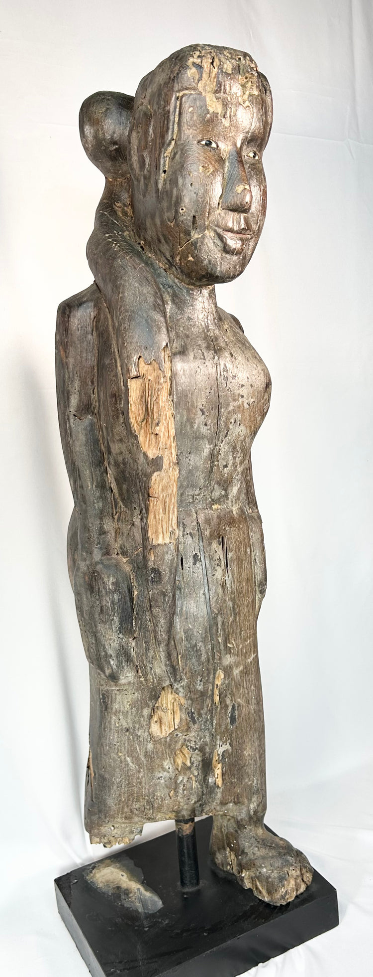 Large antique Borneo wooden ritual figure with elongated proportions