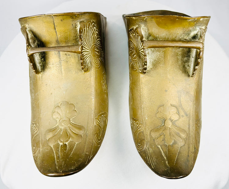 Decorative antique brass stirrup pair used in Latin American equestrian tradition.