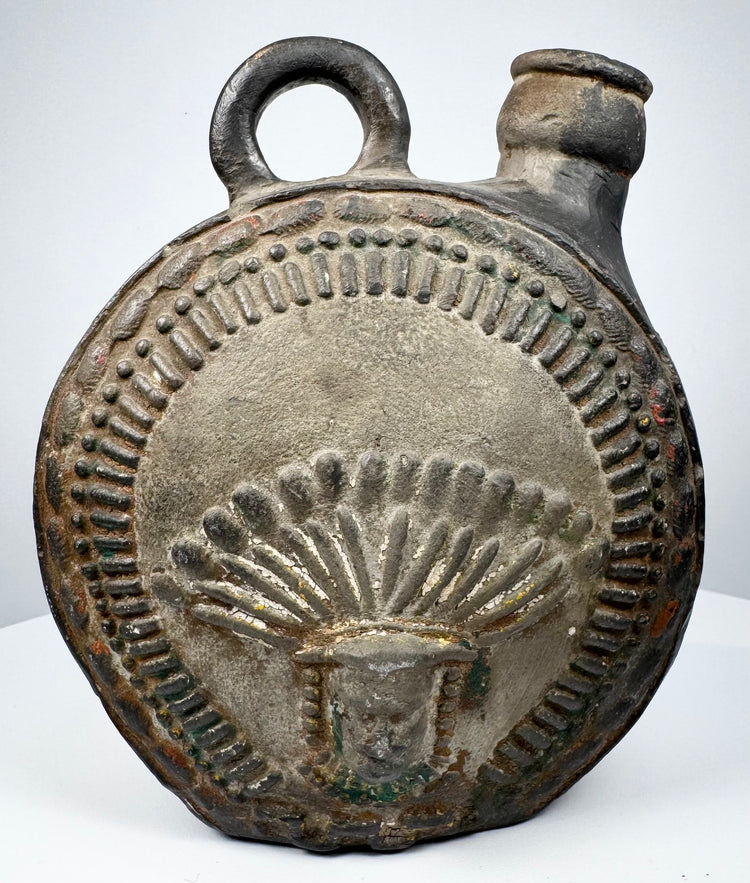 Ancient Peruvian pottery flask with radiating headdress and stepped geometric border