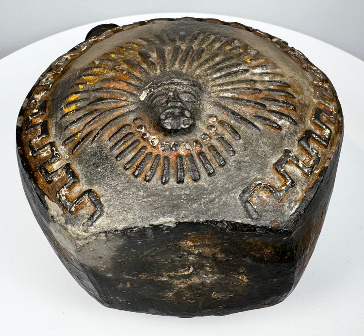 Ancient Peruvian blackware vessel with circular body and prominent loop handle