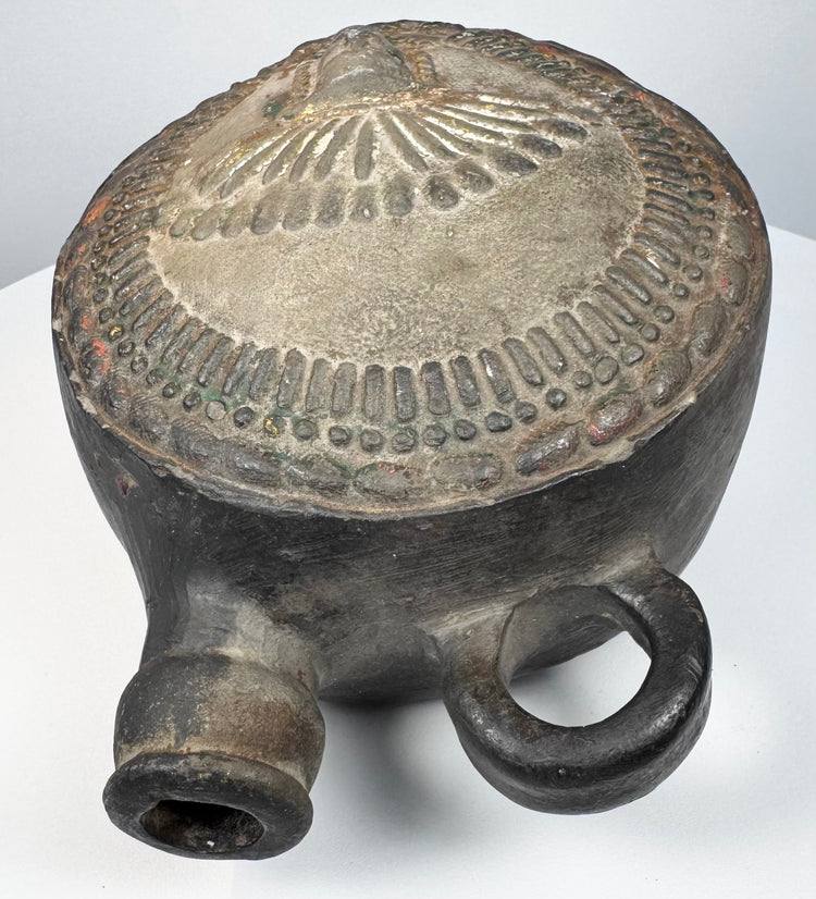 Andean pottery vessel with elaborate headdress imagery and tubular spout