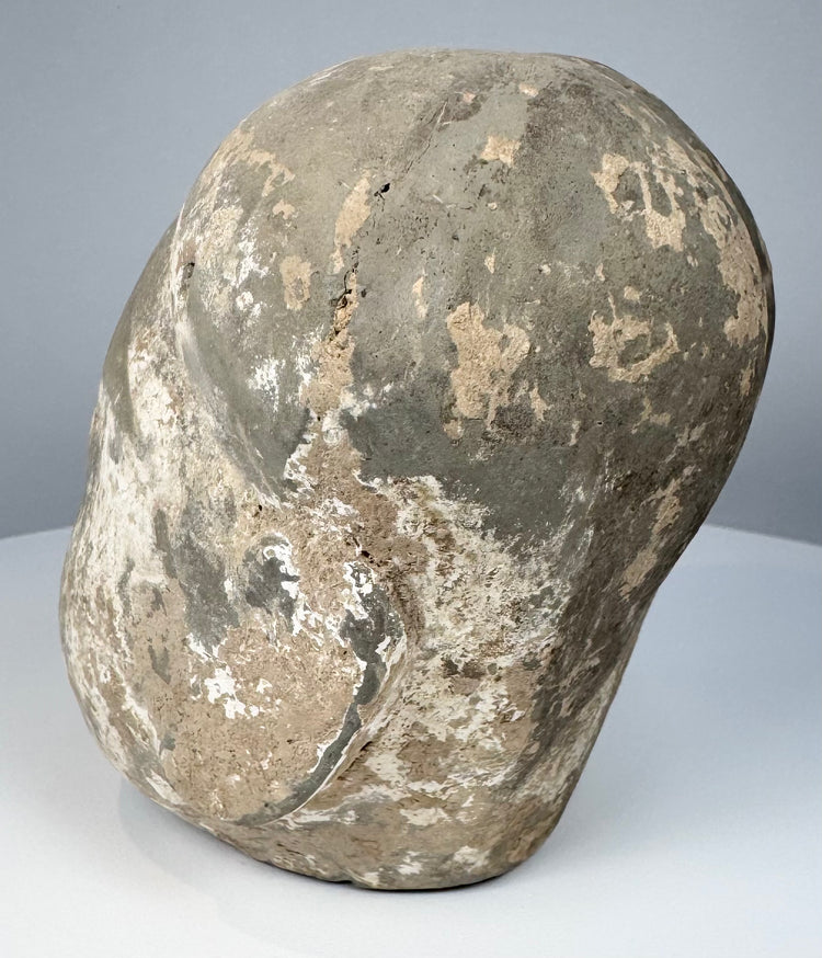 Ancient Chinese pottery sculpture fragment with two small apertures near the upper sides of the head