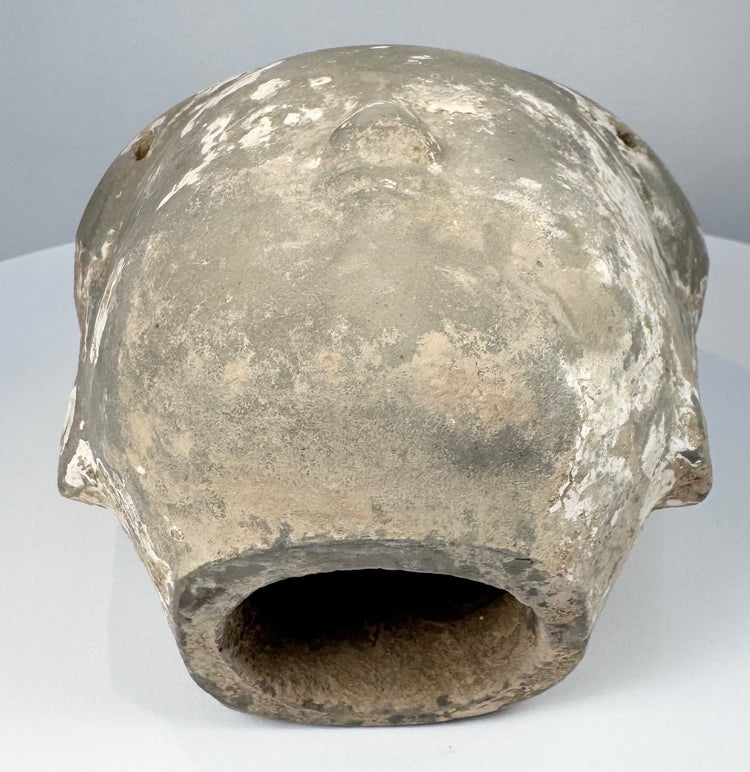 Ancient Chinese ceramic head from a larger sculptural figure with pale coating remnants and age-related wear