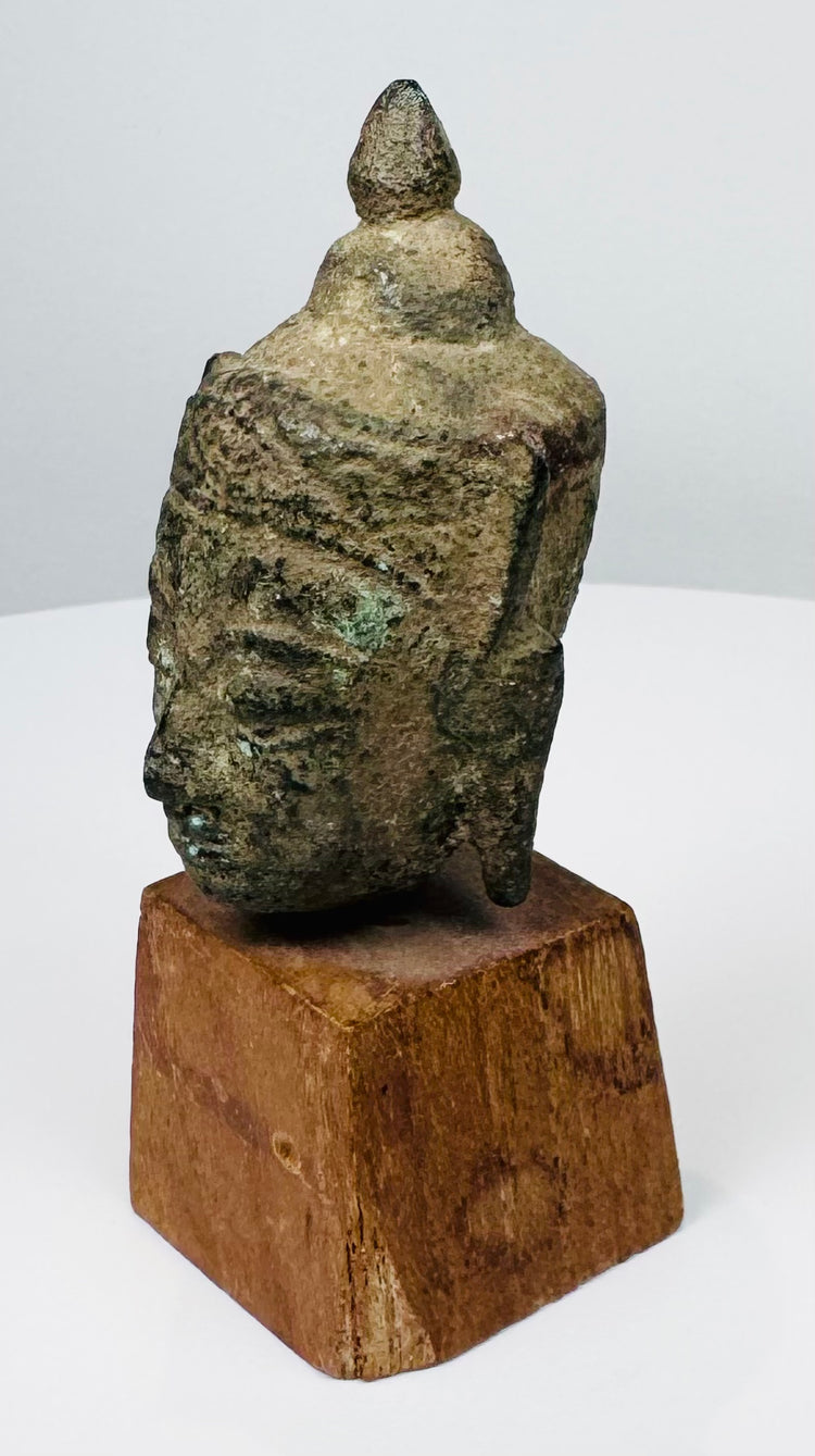 Thai Buddhist bronze sculpture fragment with serene facial features and pointed ushnisha finial