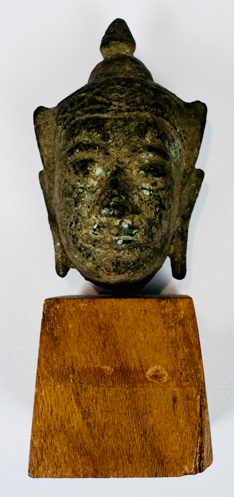 18th-century or earlier Thai bronze Buddha head with serene expression and richly encrusted surface