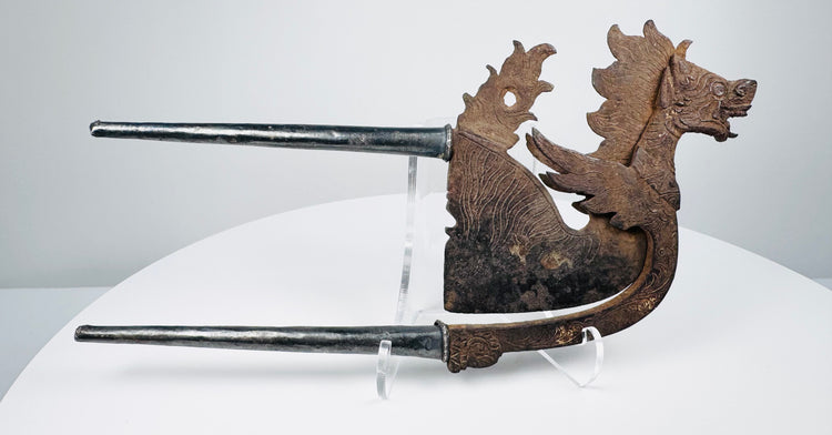 Antique Balinese-style areca nut cutter with mythical dragon-lion form and silver-toned handles