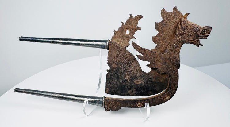 Antique Southeast Asian betel nut cutter with toothy mythical animal head and dark aged patina