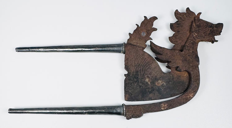 Antique dragon-lion areca nut cutter from Indonesia with incised ornament and silver-covered handles
