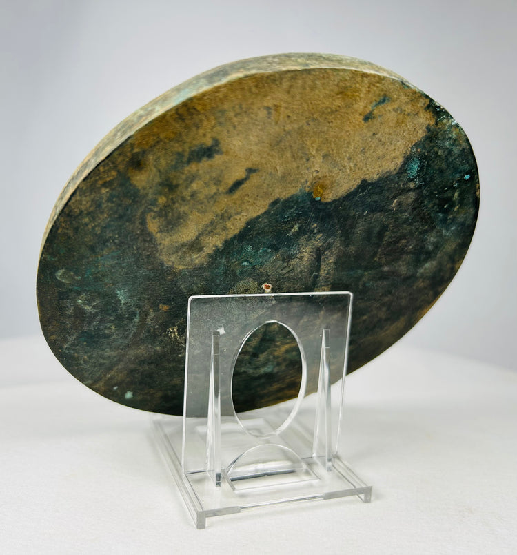 Tang style bronze mirror showing aged green and brown patina