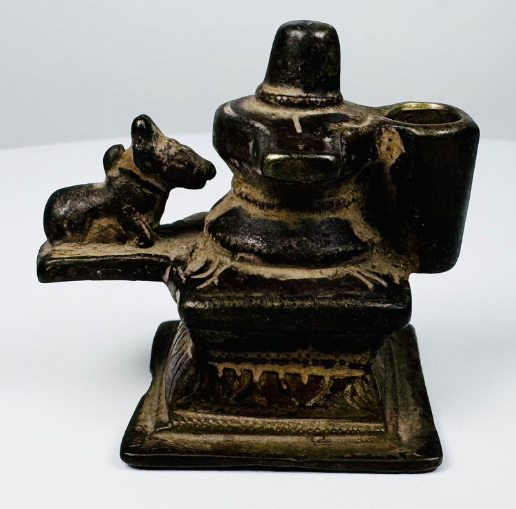 19th century cast brass Shiva shrine from India featuring Lingam, Nandi, and decorative stepped base.