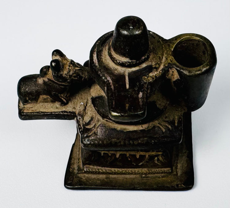 Antique Indian brass Lingam and Nandi devotional shrine with architectural base and surface accretions.