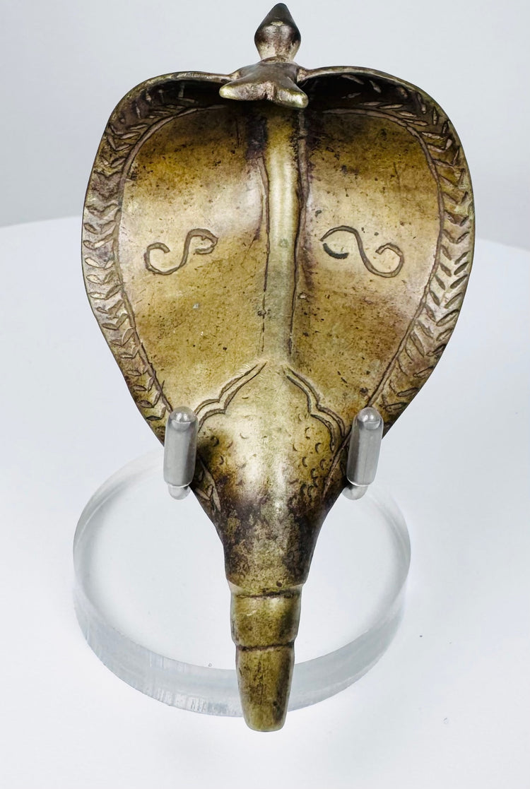 Antique Hindu devotional Naga cobra canopy from India with engraved scale and chevron decoration.