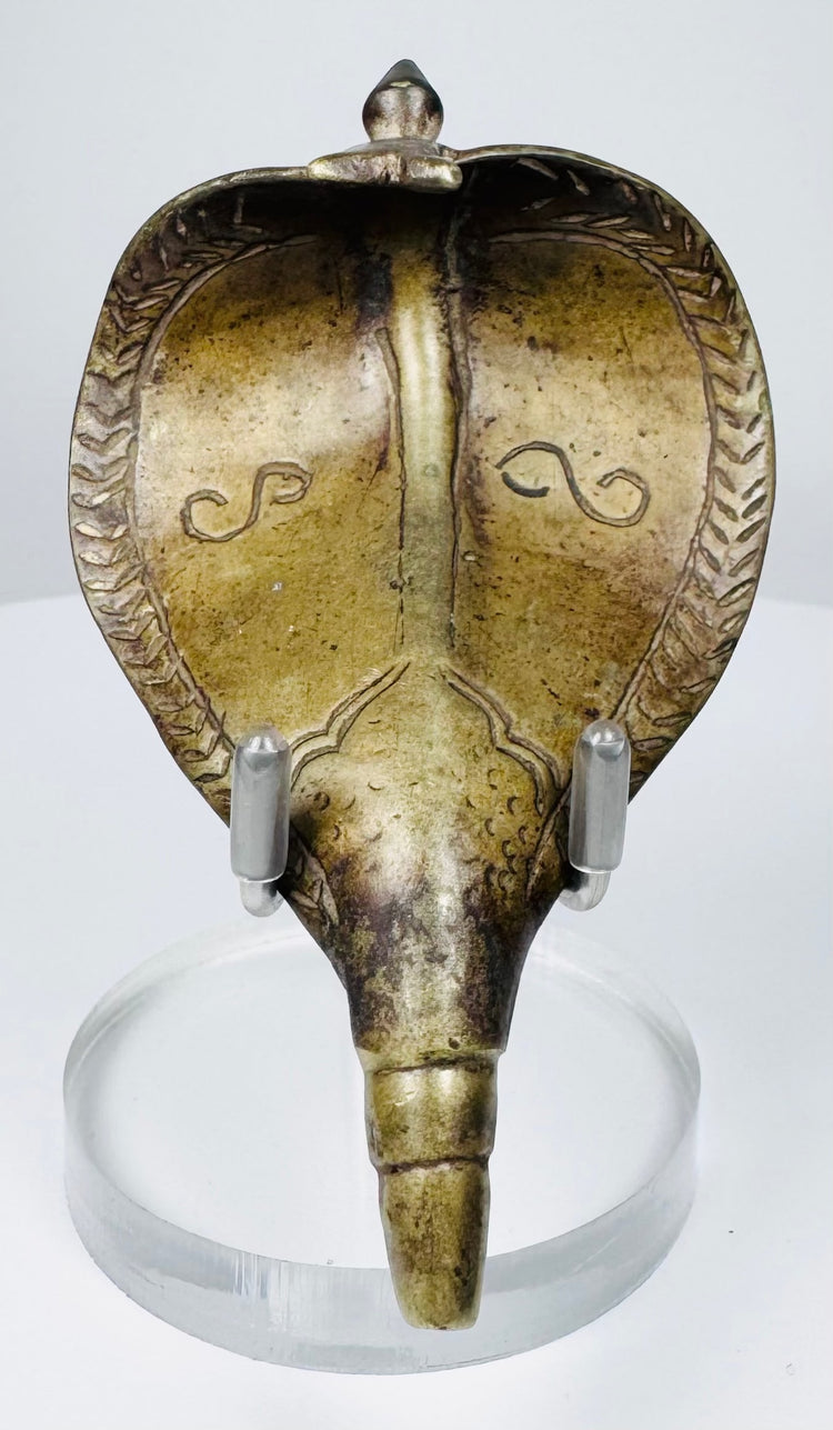 Indian Naga cobra shrine canopy in cast copper alloy with ornate incised hood decoration.