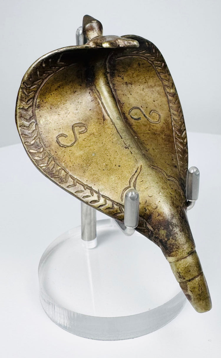 Indian brass Naga cobra canopy with engraved hood decoration and tapered mounting tang, circa 19th century.