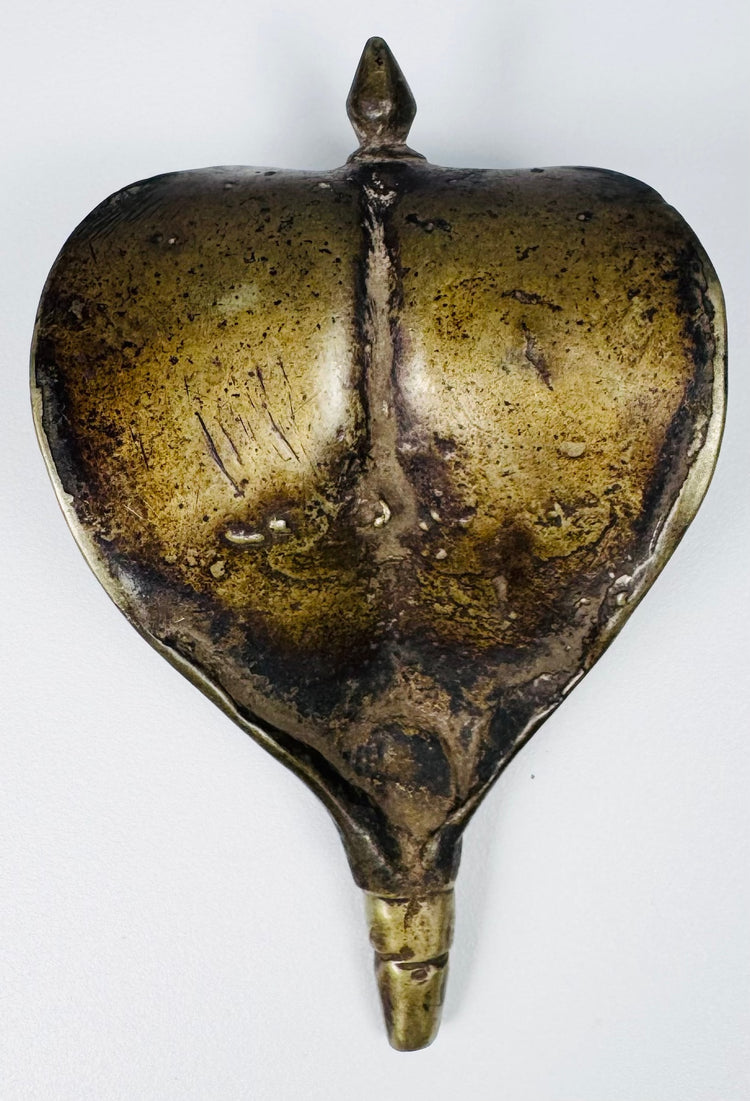 19th century Indian Naga canopy with broad flared cobra hood, engraved motifs, and aged surface patina.