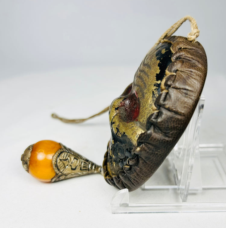 Himalayan ritual hanging mask with metal-mounted bead ornament