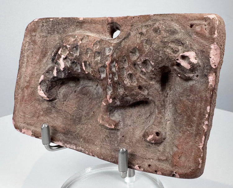 Antique Indian terracotta animal plaque with raised feline figure, rounded corners, and historic surface deposits.