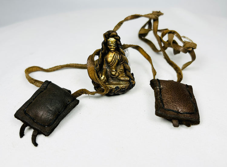 Antique Tibetan leather traveling shrine with small Buddha figure