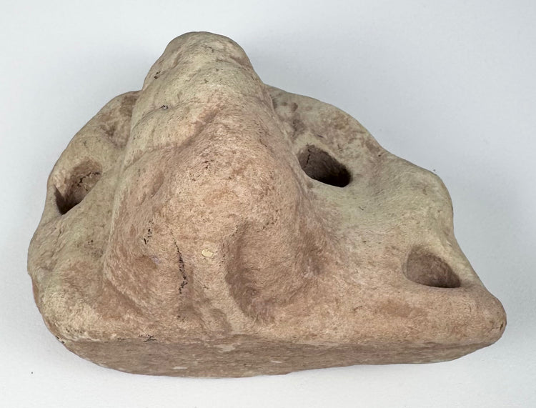 Pre-Columbian stone trigonolith associated with the Taíno zemí tradition of Puerto Rico or Hispaniola.