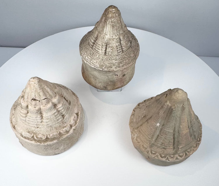 Early medieval Buddhist terracotta stupas showing three distinct moulded architectural designs