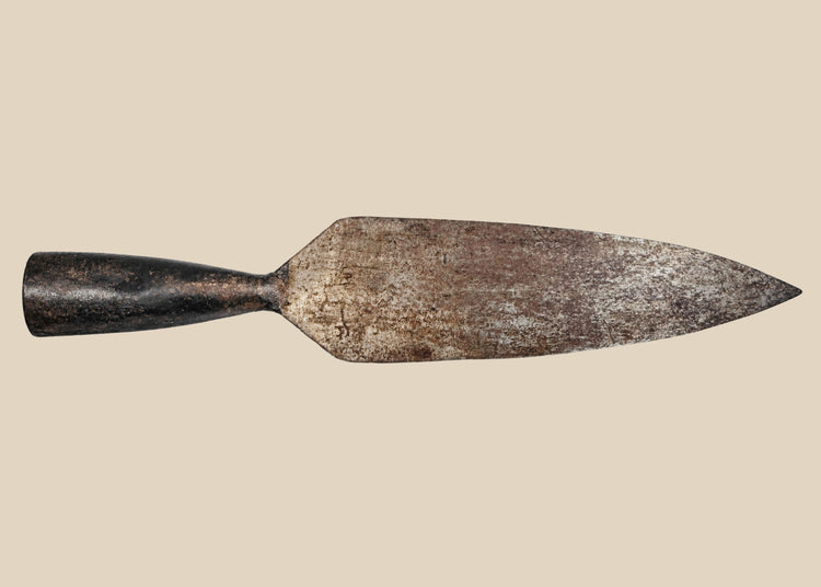 18th-century Indo-Persian forged iron spearhead with broad leaf-shaped blade, tapered socket, and aged patina.