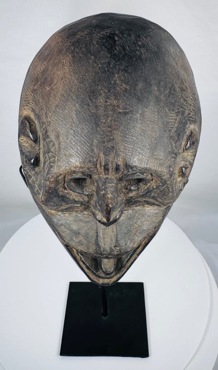 Early 20th-century Fatuleu Village mask displaying traditional Timorese tribal craftsmanship and spiritual symbolism.