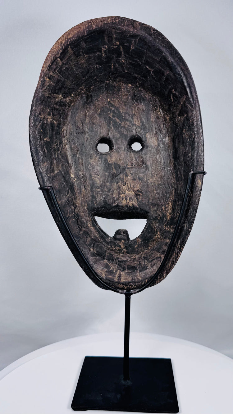 West Timor ancestral ritual mask showcasing hand-tool carving marks and early twentieth-century craftsmanship.