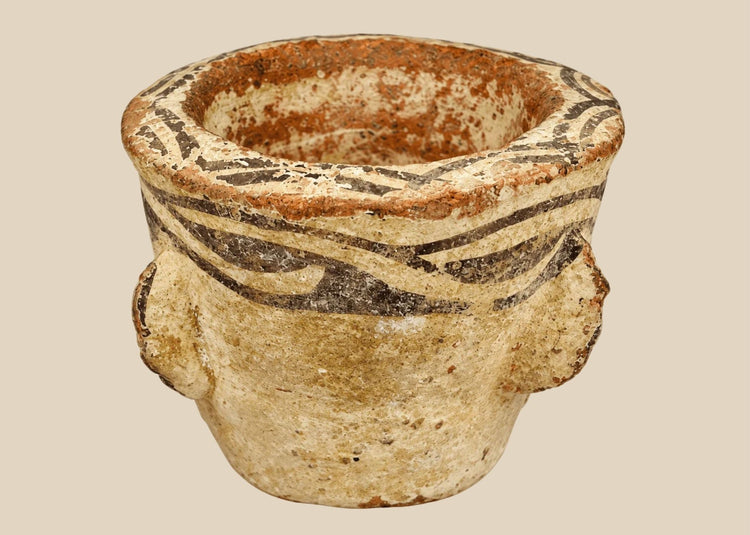 12th century Islamic terracotta mortar with wavy slip decoration and lug handles