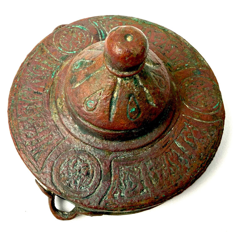 Historic Khorassan bronze writing accessory displaying preserved floral patterns, geometric detailing, and naturally weathered bronze surfaces.
