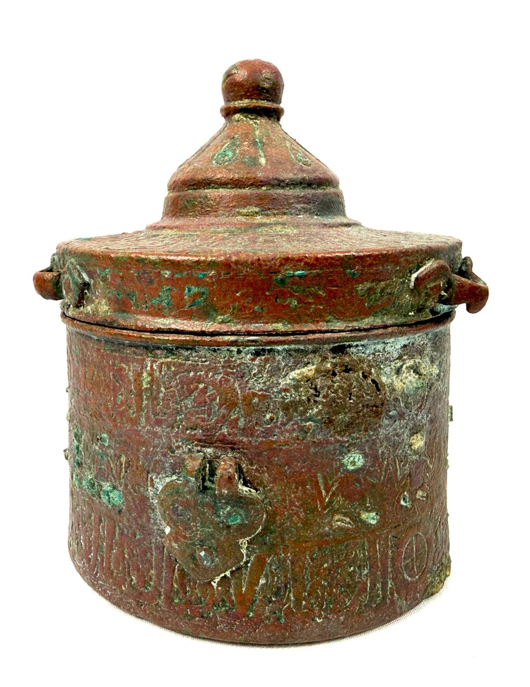 Antique Persian Khorassan bronze inkwell with intricate surface decoration and natural oxidation developed over centuries of age.