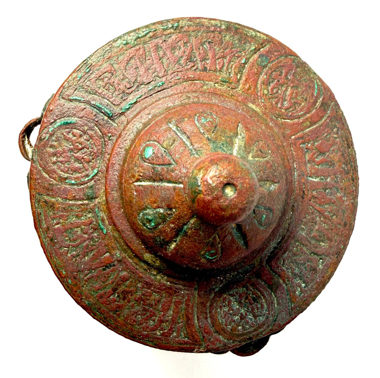 Ancient Khorassan bronze inkwell displaying finely engraved decorative patterns and a rich green and brown aged patina.