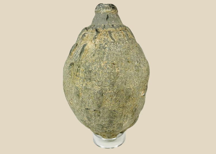 Medieval Islamic ceramic hand grenade from Greater Persia, 10th–12th century CE, bulbous body with narrow neck and textured surface, used for incendiary purposes