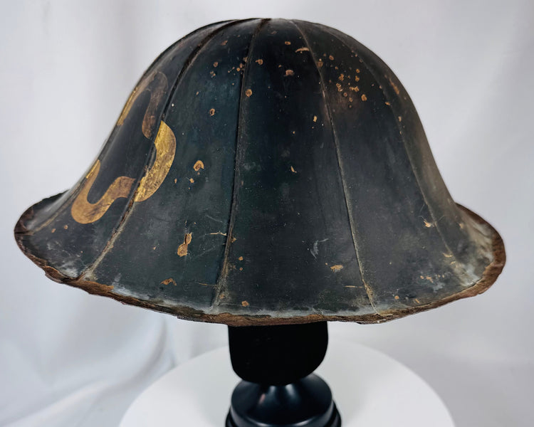 Antique Japanese lacquered helmet with segmented dome and surviving interior red lacquer