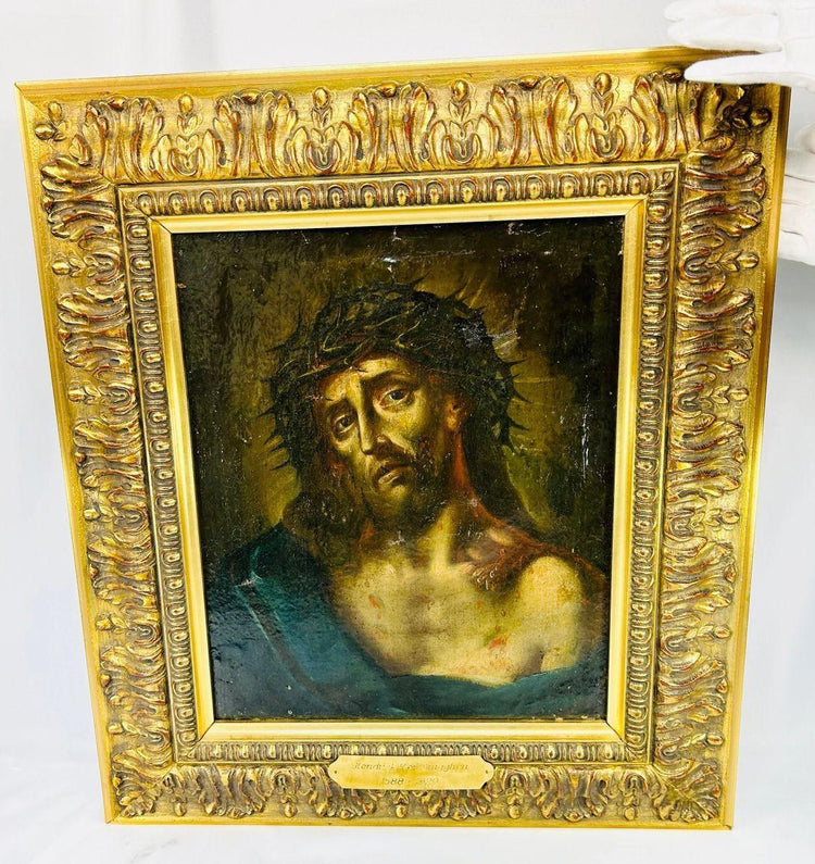 Dutch Baroque Ecce Homo oil painting showing Jesus crowned with thorns with dramatic chiaroscuro lighting in a decorative gilded frame.