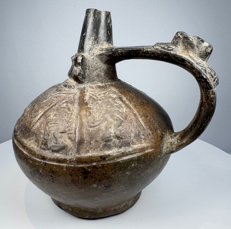 Historic Sicán pottery vessel with lustrous black ceramic surface and preserved Pre-Columbian craftsmanship.