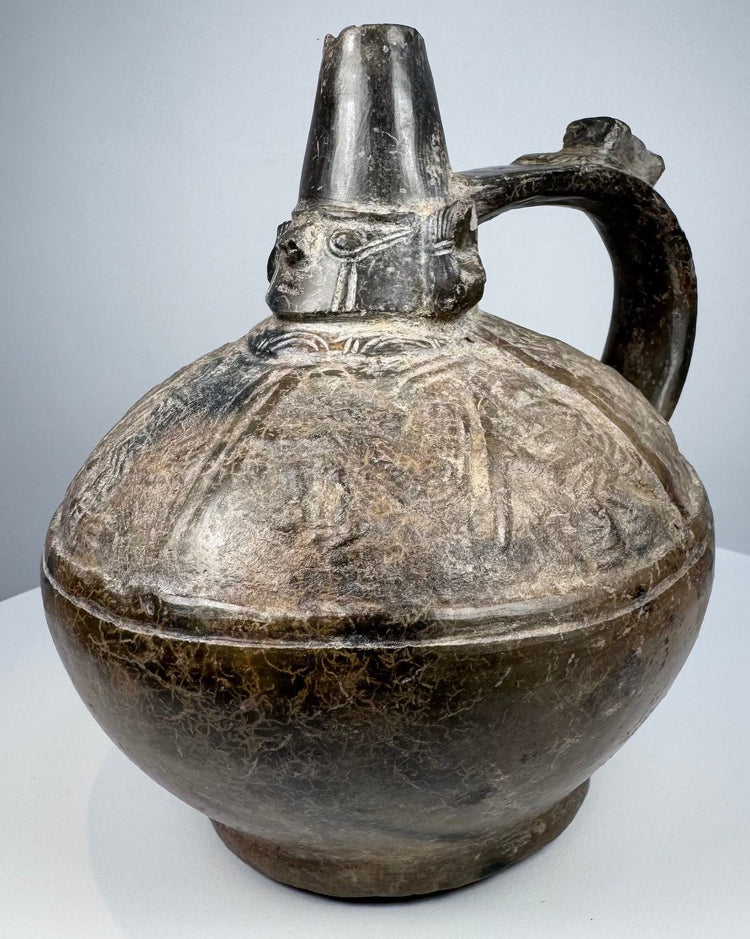 Ancient Peruvian blackware ceramic from the Lambayeque culture, dating to approximately 750–1375 AD.