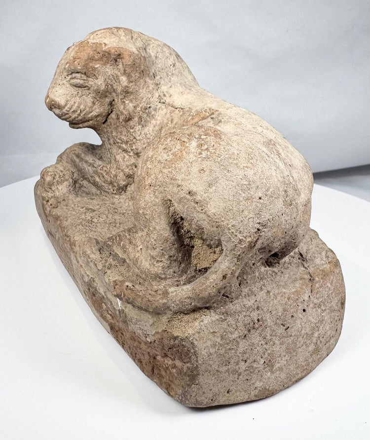 Ancient Alexandria terracotta lion figure resting on a plinth, circa 3rd–2nd century BCE