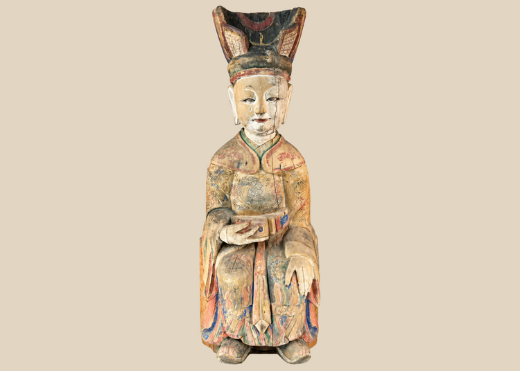 Chinese carved wooden sculpture of a seated court official with original polychrome decoration.