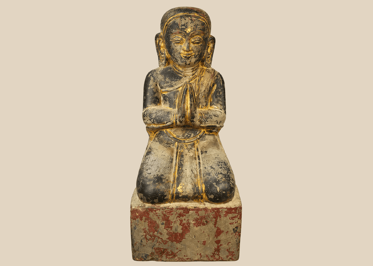 Burmese carved wood sculpture of a kneeling Buddhist devotee with hands in prayer, Mandalay period.
