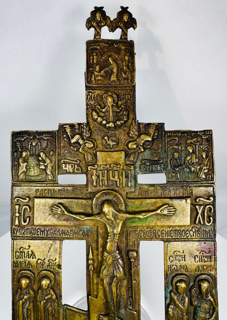 Russian Orthodox cast bronze cross with Church Slavonic inscriptions and multiple biblical scenes.