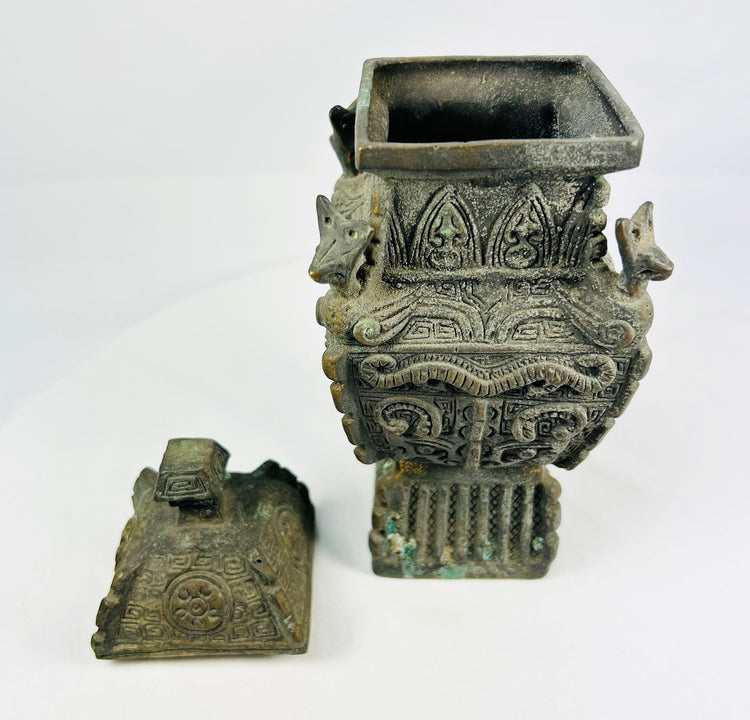 Antique Chinese archaistic bronze inspired by Western Zhou ritual forms, high relief masks and thunder-scroll motifs.