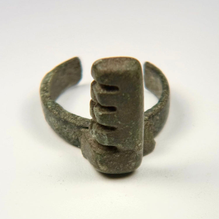Ancient Roman bronze ring key with projecting rectangular bit and four stepped locking teeth, circa 3rd–4th century CE
