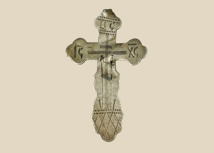 Russian Orthodox engraved silver cross, late 19th century, 84 zolotnik (.875) silver, IC XC inscriptions, Golgotha base, scalloped trefoil terminals, 1.5 x 1 inches