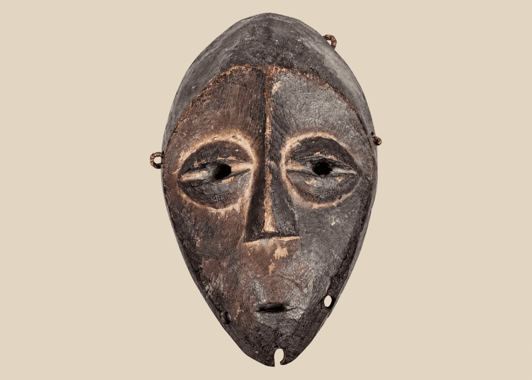 Lega passport mask carved from wood with dark ritual patina, Democratic Republic of the Congo, mid-20th century.