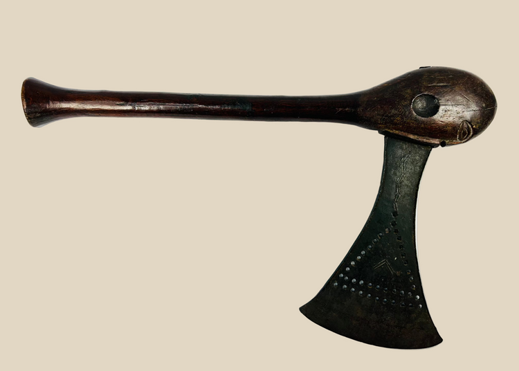 Late 19th-century Luba prestige axe from Central Africa with fan-shaped iron blade, carved hardwood haft, and eye-motif pommel, ceremonial regalia